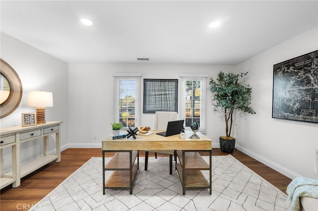 office space featuring baseboards, visible vents, wood finished floors, and recessed lighting