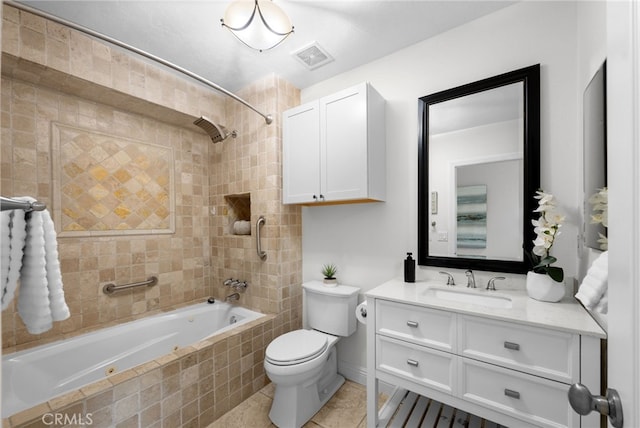 full bathroom with visible vents, toilet, tile patterned floors, tiled shower / bath combo, and vanity