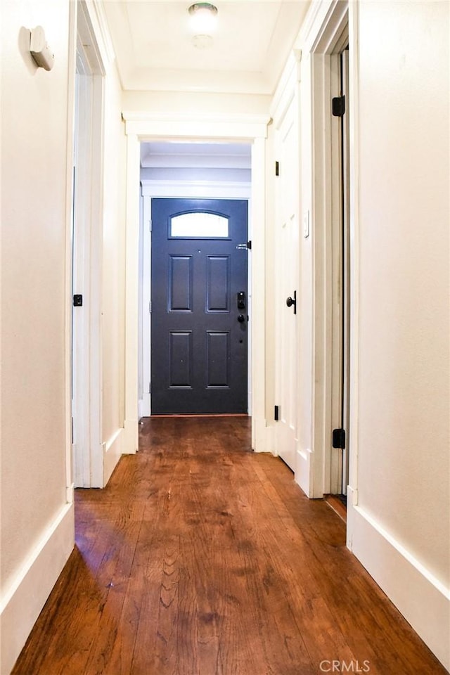 doorway to outside with dark wood-type flooring