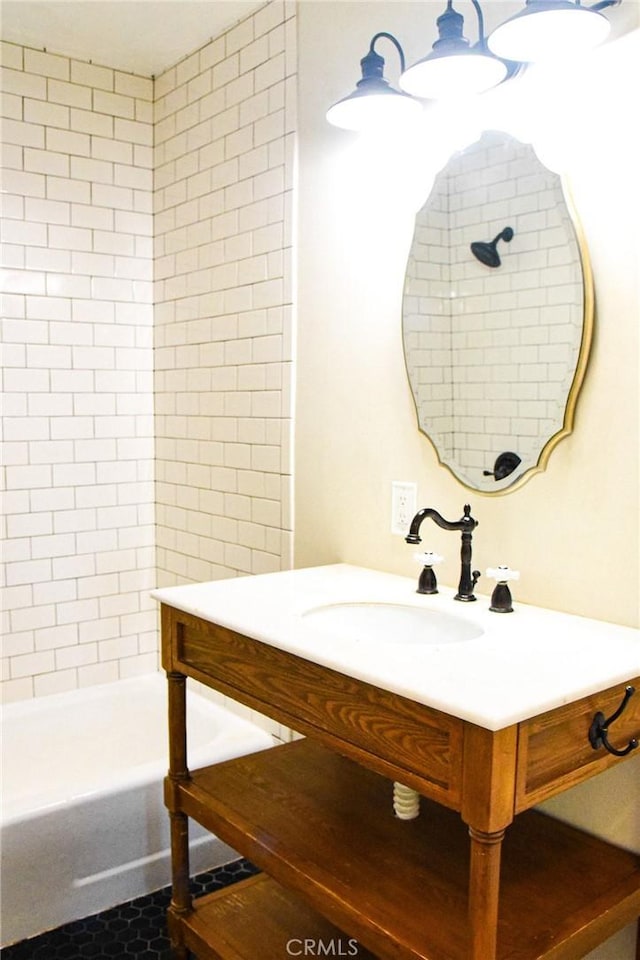 full bathroom with shower / washtub combination and vanity