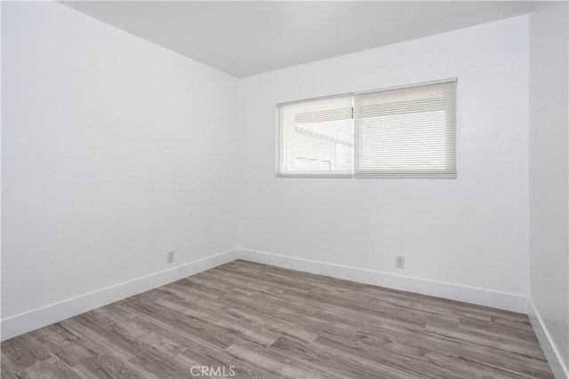 spare room with light wood-type flooring