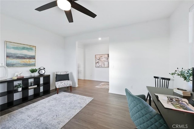 office area with dark hardwood / wood-style flooring and ceiling fan