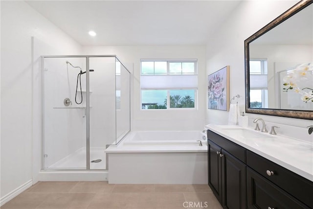 bathroom with vanity, independent shower and bath, and tile patterned flooring