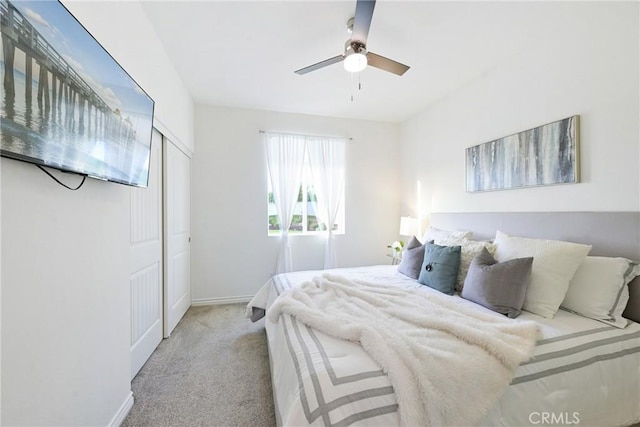 carpeted bedroom with ceiling fan