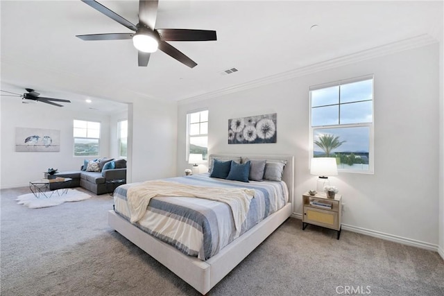 bedroom with ornamental molding, carpet flooring, and ceiling fan