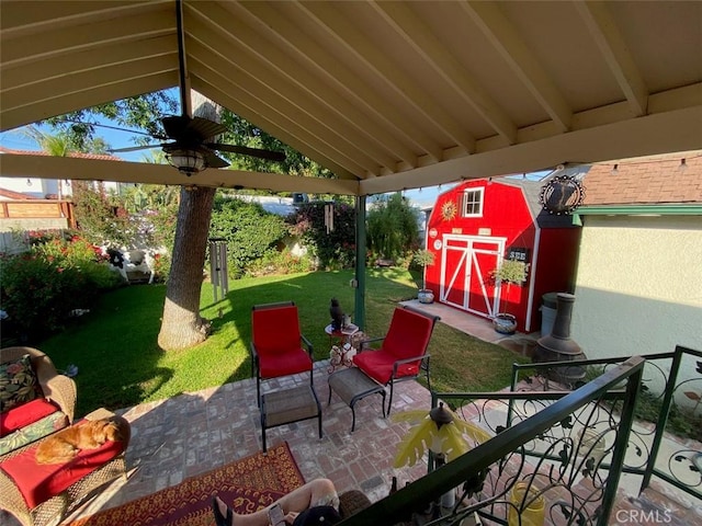 view of patio / terrace with a storage unit and an outdoor structure