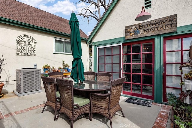 view of patio / terrace with outdoor dining area and central AC