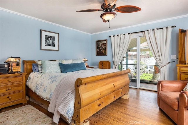 bedroom with ceiling fan, access to outside, ornamental molding, and light wood-style flooring