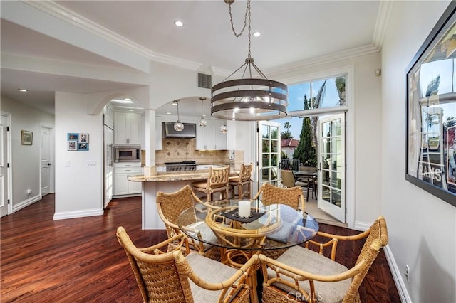 111 Via Lido Nord Unit B, Newport Beach, CA 92663 - dining room with dark wood-style flooring, arched walkways, recessed lighting, a chandelier, and crown molding