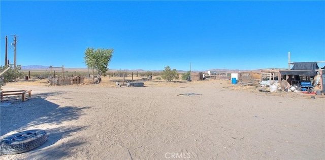 view of yard with a rural view