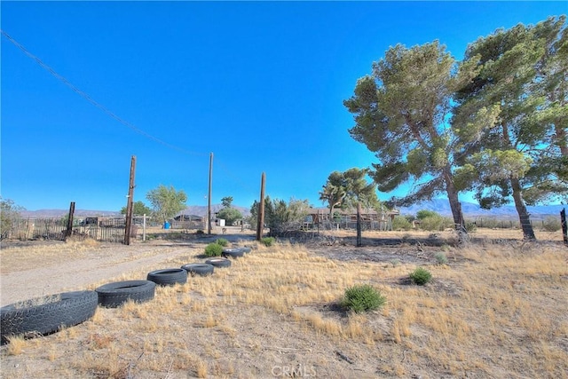 view of yard with a rural view