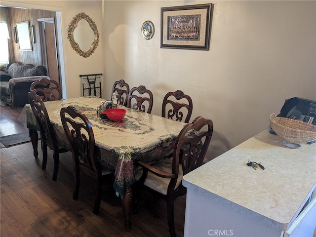 dining space featuring dark wood finished floors