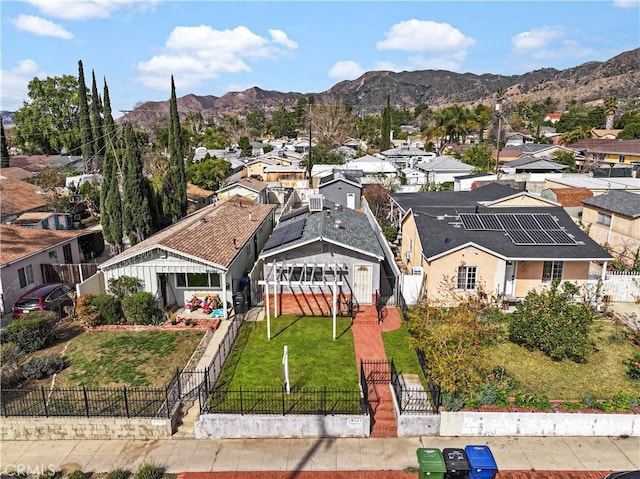 birds eye view of property with a mountain view