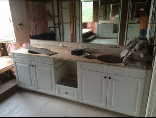 kitchen featuring light countertops and white cabinetry