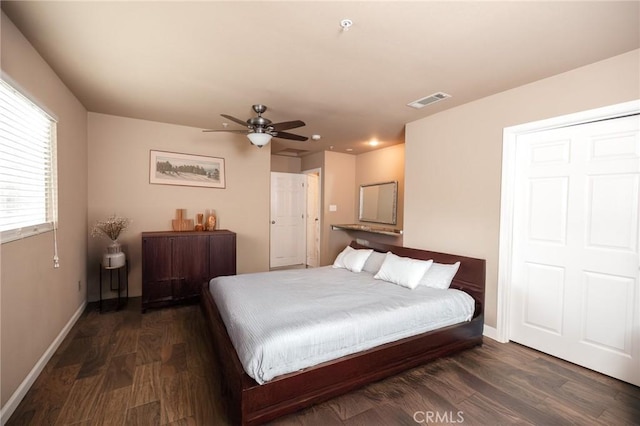 bedroom with dark wood-type flooring and ceiling fan