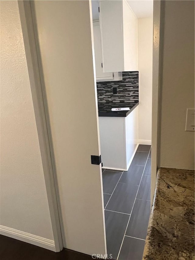 7422UNIT7 Hazeltine Ave Unit 7, Van Nuys, CA 91405 - hallway with baseboards and dark tile patterned flooring