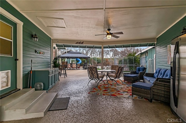 view of patio / terrace with outdoor lounge area, ceiling fan, and a gazebo