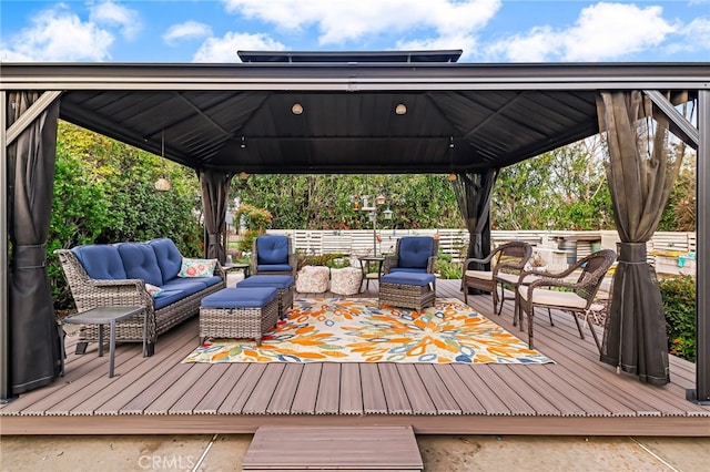 deck featuring a gazebo and an outdoor hangout area