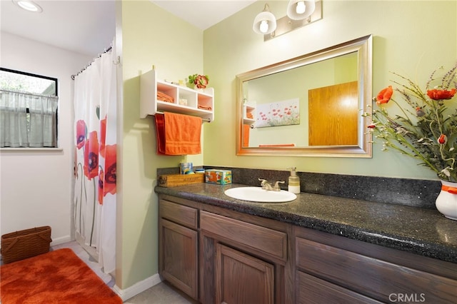 bathroom with vanity and curtained shower