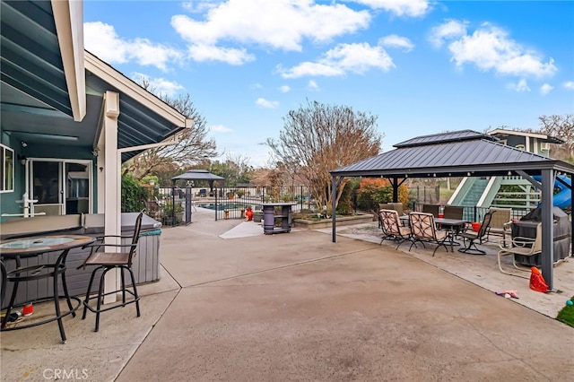 view of patio featuring grilling area and a gazebo