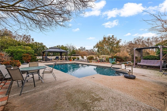 view of pool with a patio and a gazebo