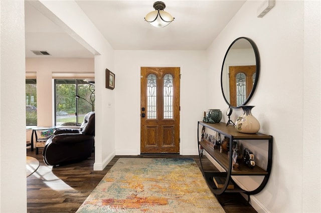 entryway with dark wood-type flooring