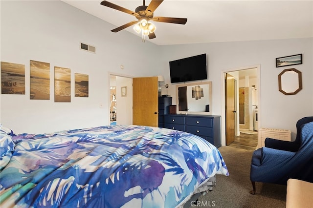 bedroom with dark carpet, ensuite bathroom, vaulted ceiling, and ceiling fan