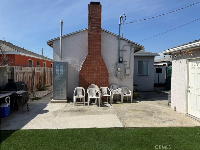 rear view of house featuring a patio area