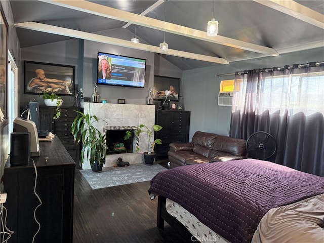 bedroom with lofted ceiling with beams, a tile fireplace, an AC wall unit, and dark hardwood / wood-style floors