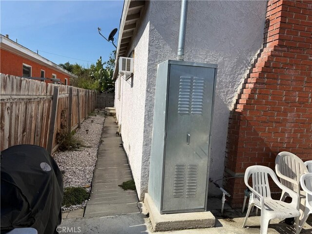 1408 S Burris Ave, Compton, CA 90221 - exterior view of stucco siding and a satellite dish