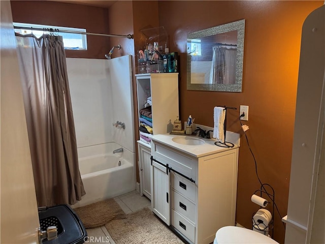 bathroom featuring tile patterned flooring, vanity, and shower / tub combo