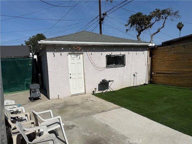 view of outbuilding with a lawn