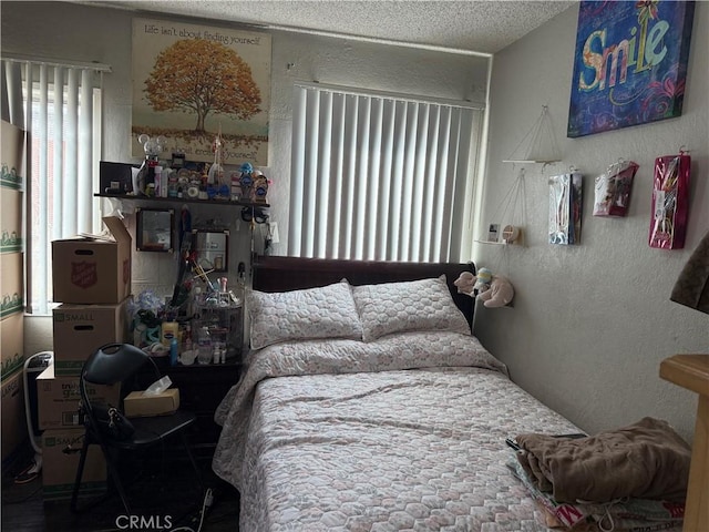 bedroom featuring a textured ceiling