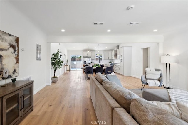 living room with light hardwood / wood-style floors