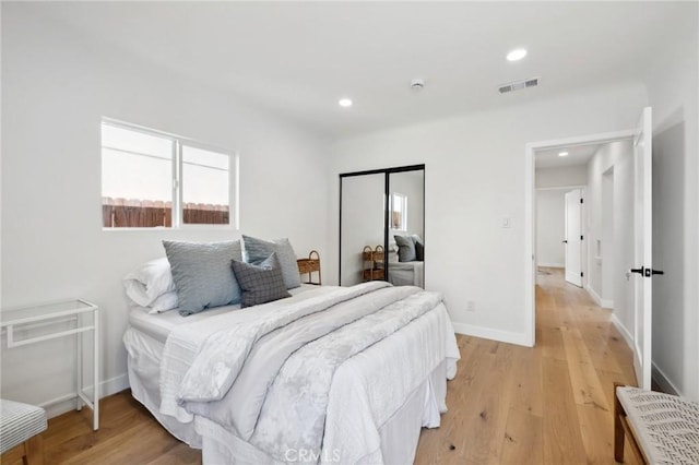 bedroom with light hardwood / wood-style flooring