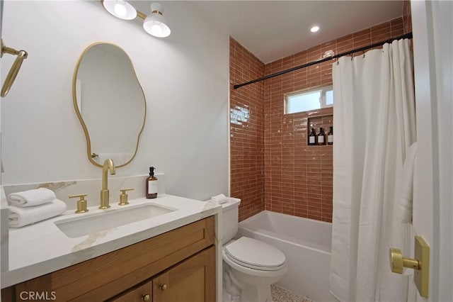 full bathroom featuring shower / bath combo, vanity, and toilet