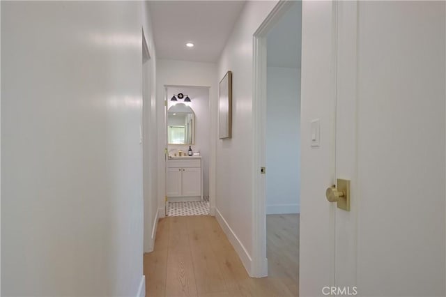 hall with light hardwood / wood-style flooring