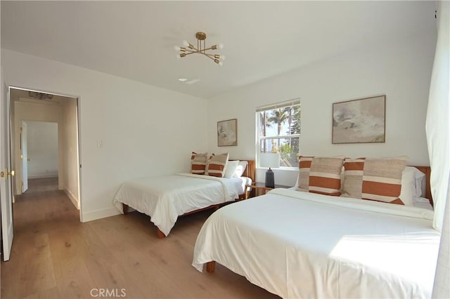 bedroom with light hardwood / wood-style flooring