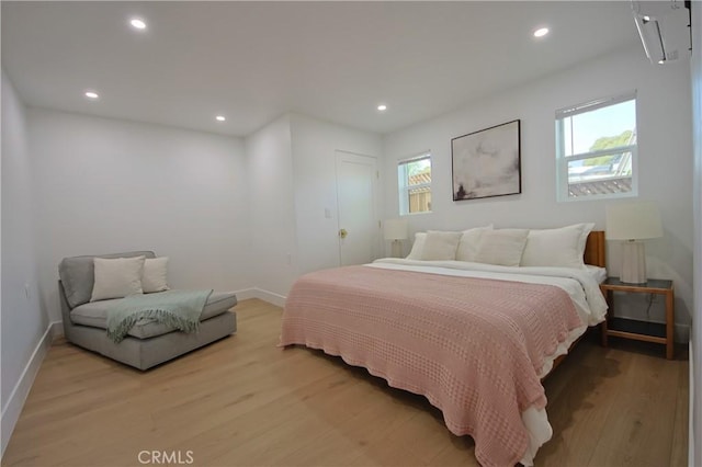 bedroom with light hardwood / wood-style floors