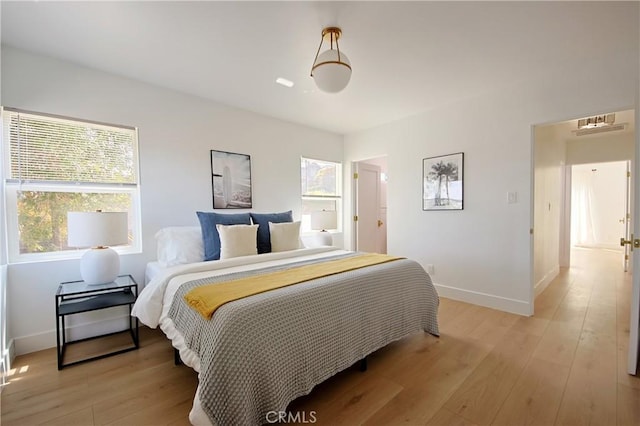 bedroom with light wood-type flooring