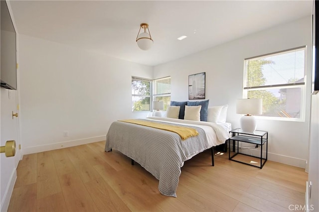 bedroom with light hardwood / wood-style floors