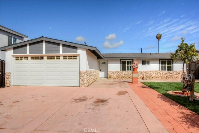 ranch-style home featuring a garage