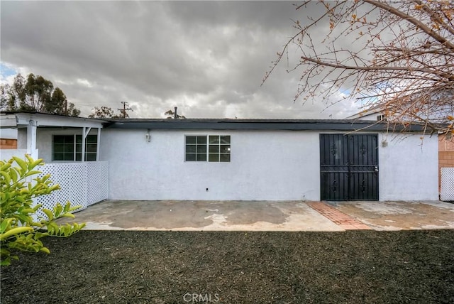 rear view of property featuring a patio area