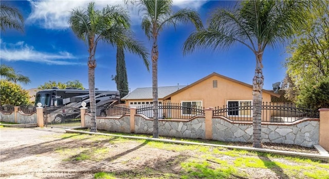 rear view of property featuring a garage