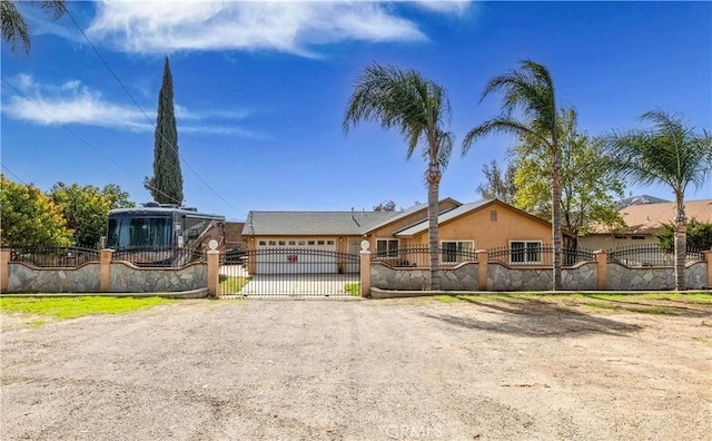 single story home with a garage