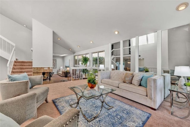 living room featuring light carpet, high vaulted ceiling, stairway, and recessed lighting