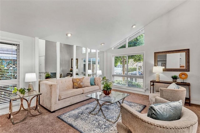 living room featuring baseboards, high vaulted ceiling, carpet flooring, and recessed lighting