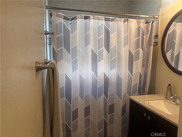 bathroom featuring a shower with curtain and vanity