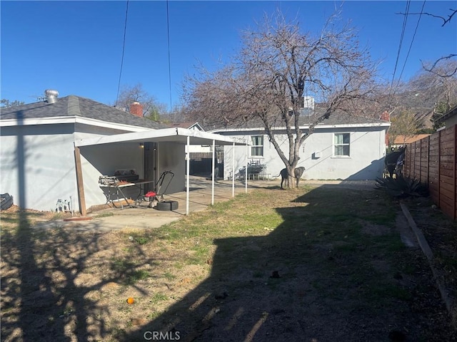 view of yard with a patio area and a fenced backyard