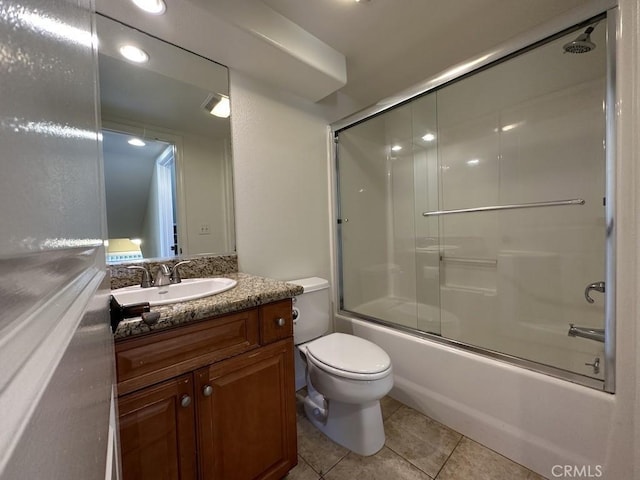 full bathroom with toilet, vanity, bath / shower combo with glass door, and tile patterned flooring